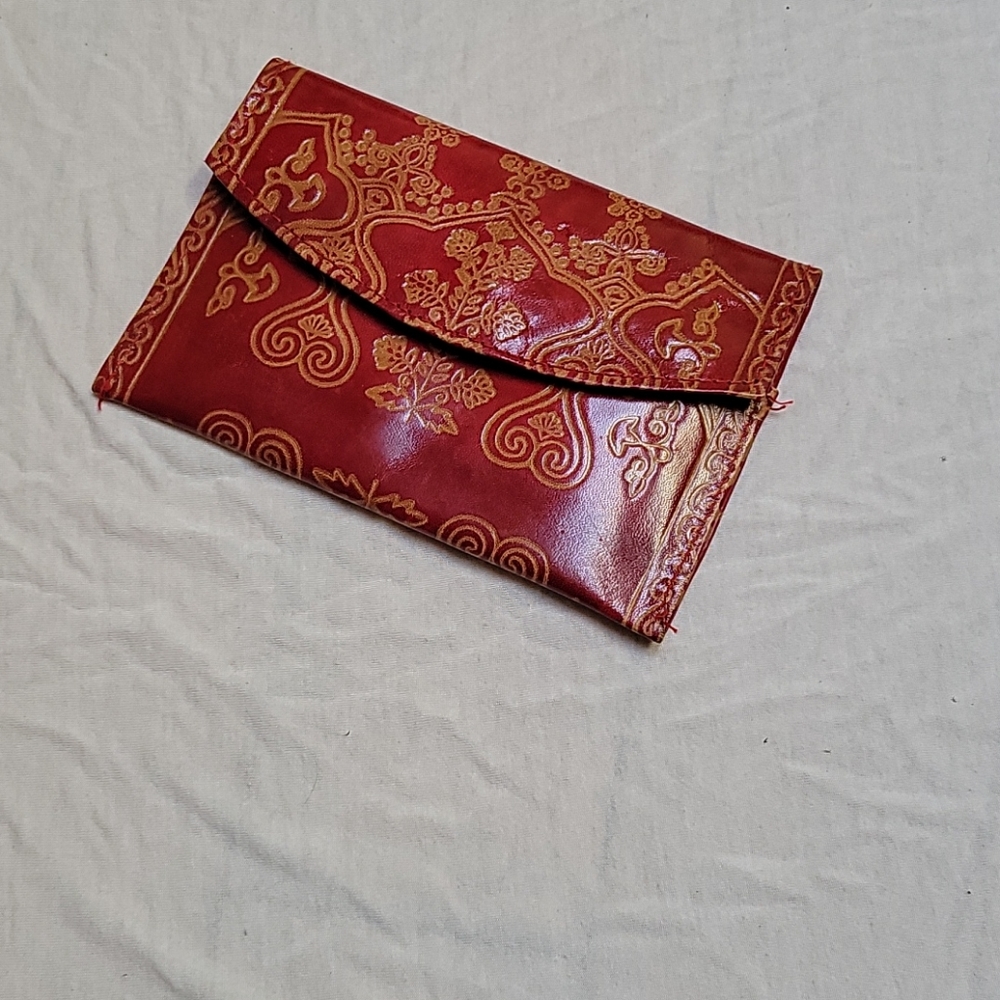 Red leather purse with beautiful designs